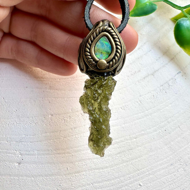 Natural gemstone pendant featuring Moldavite and Boulder Opal