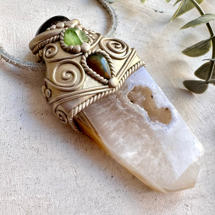 This unique spiritual crystal wand is inspired by grounding, protection, renewal, intuition, transformation and inner strength. A beautiful handmade gemstone talisman for meditation, energy work, spiritual rituals, intention setting.