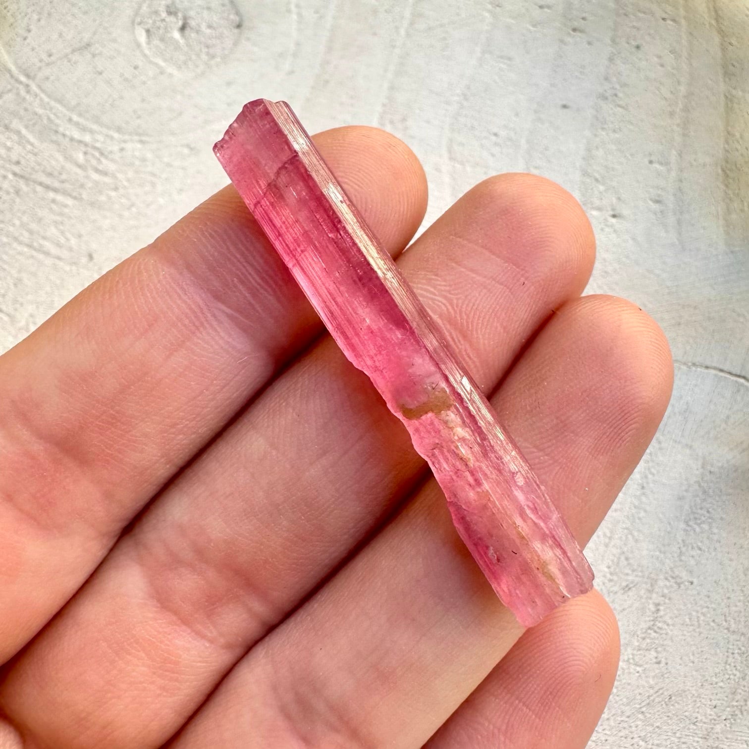 Close up of raw pink tourmaline crystal