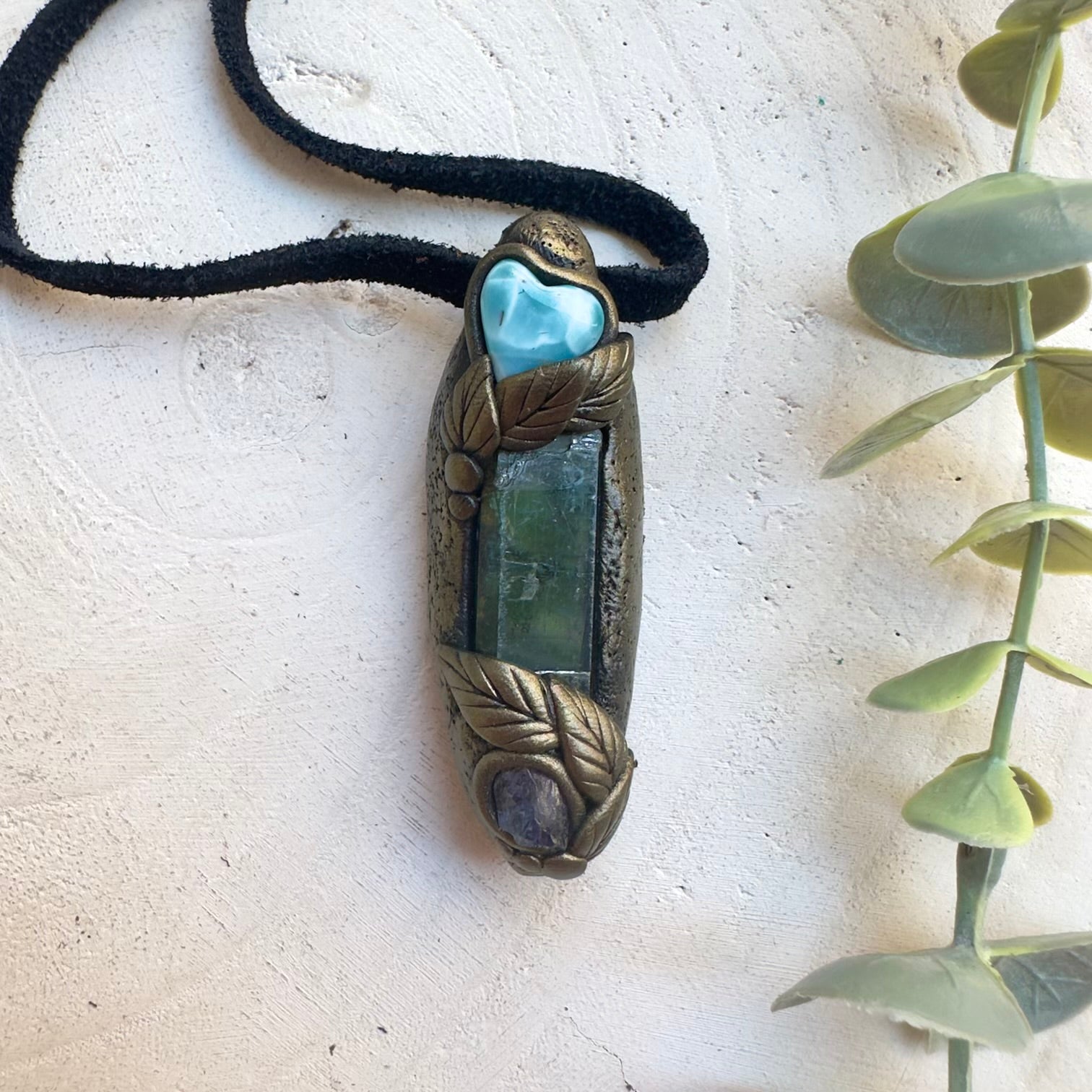 Healing crystal jewelry featuring Vivianite, Larimar and raw Tanzanite