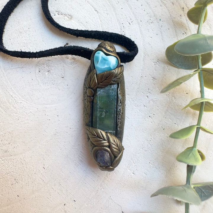 Healing crystal jewelry featuring Vivianite, Larimar and raw Tanzanite