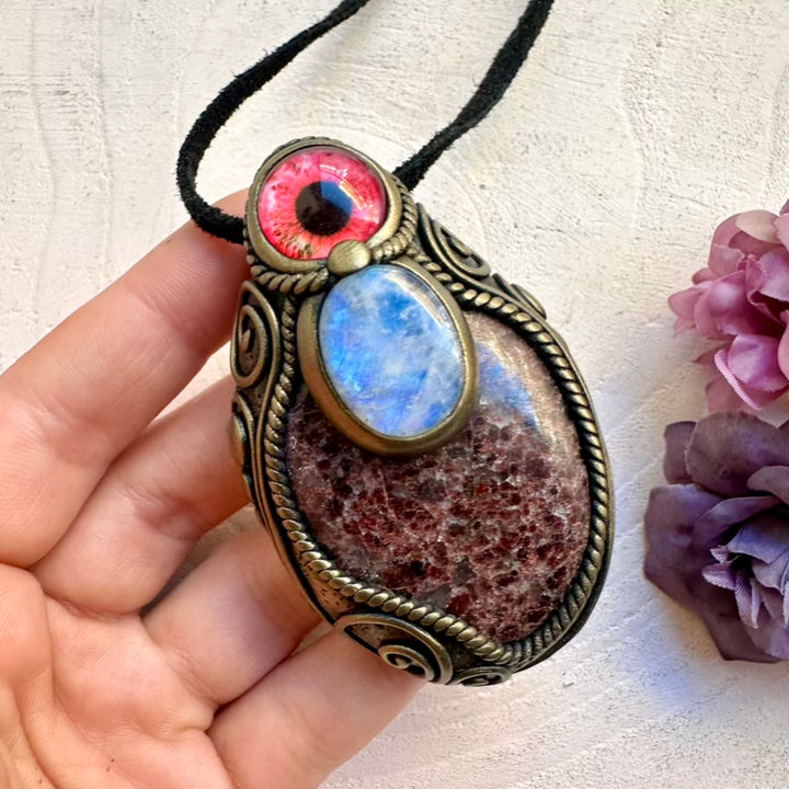 Raw-look large red Garnet crystal pendant necklace combined with glowing Rainbow Moonstone protective eye amulet.