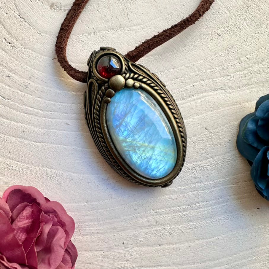 Rainbow Moonstone gemstone pendant paired with Red Garnet