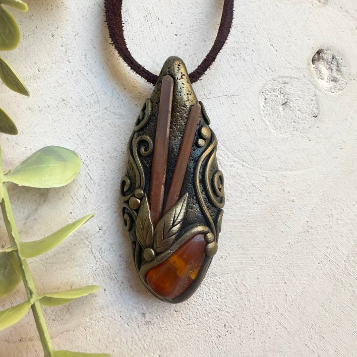 Baltic Amber pendant necklace with Red Quartz crystal