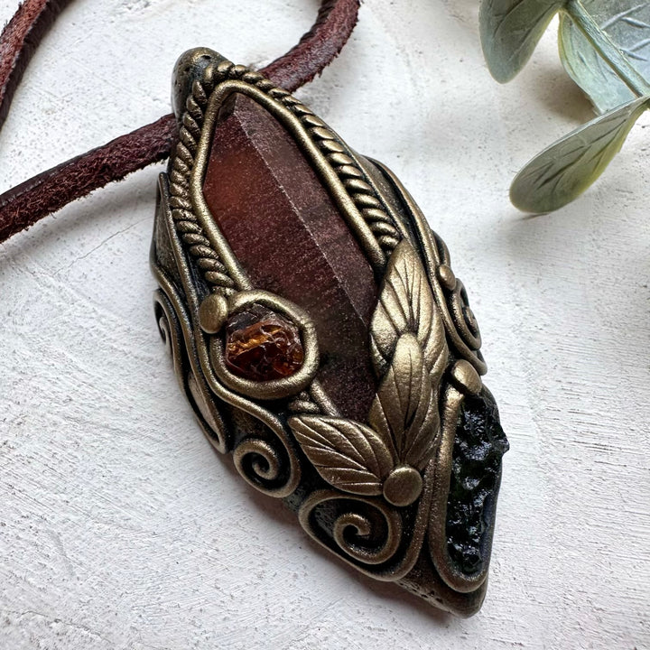 Spiritual jewelry combining red quartz moldavite and garnet