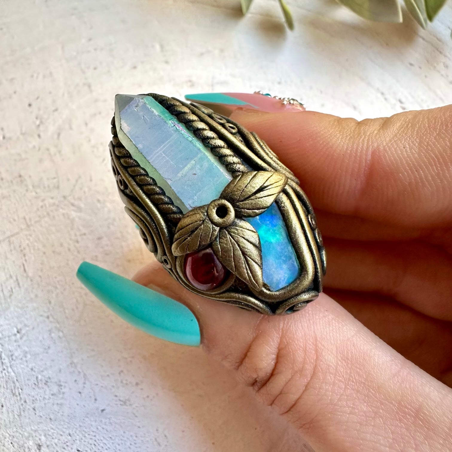 Spiritual jewelry ring combining opal and garnet crystals