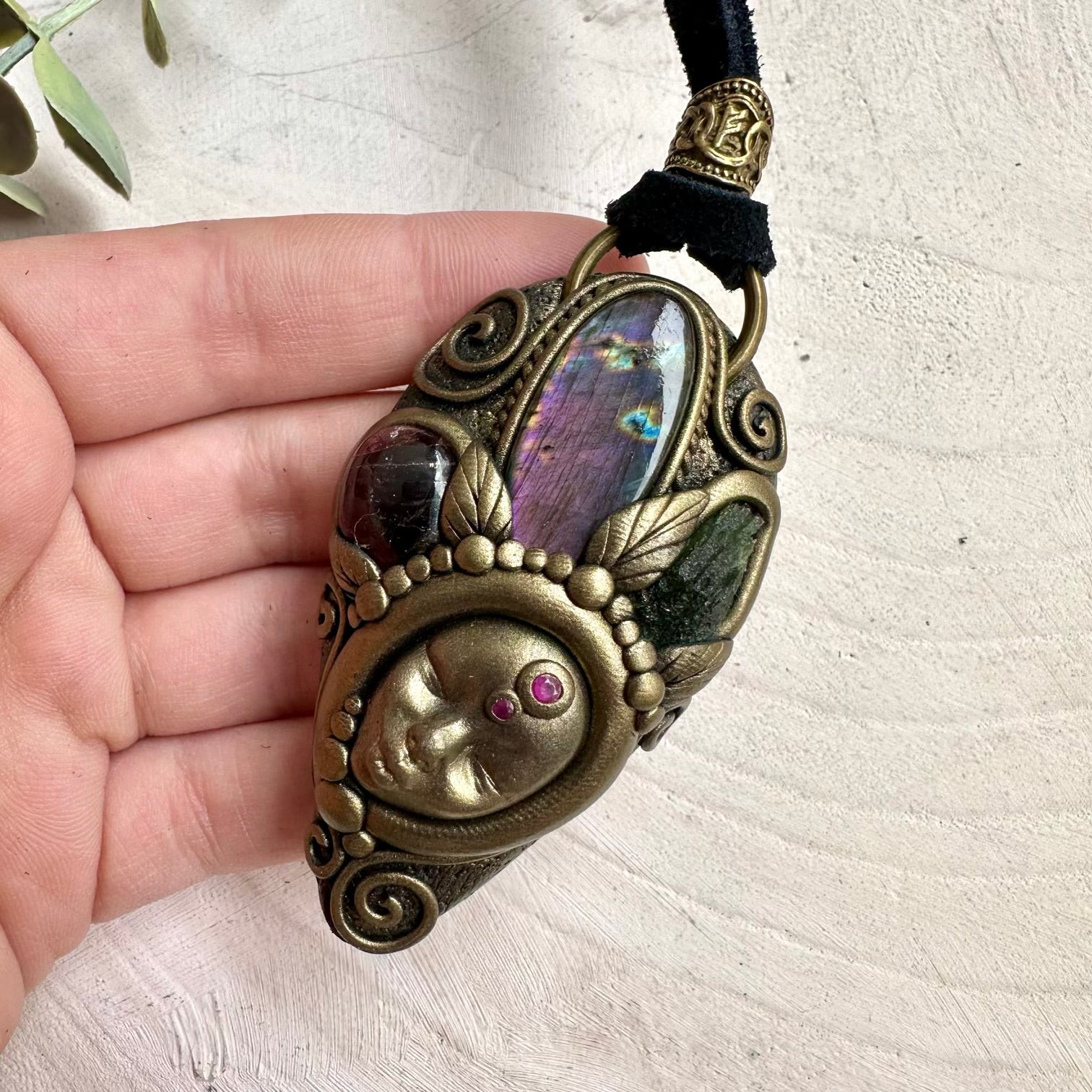 Moldavite paired with labradorite ruby and garnet in a necklace