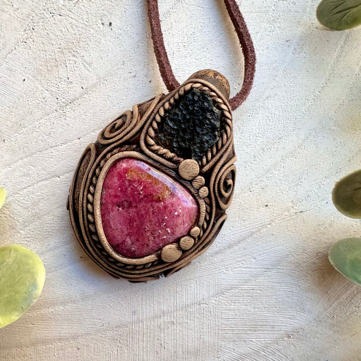 Rhodonite paired with moldavite in a handmade necklace