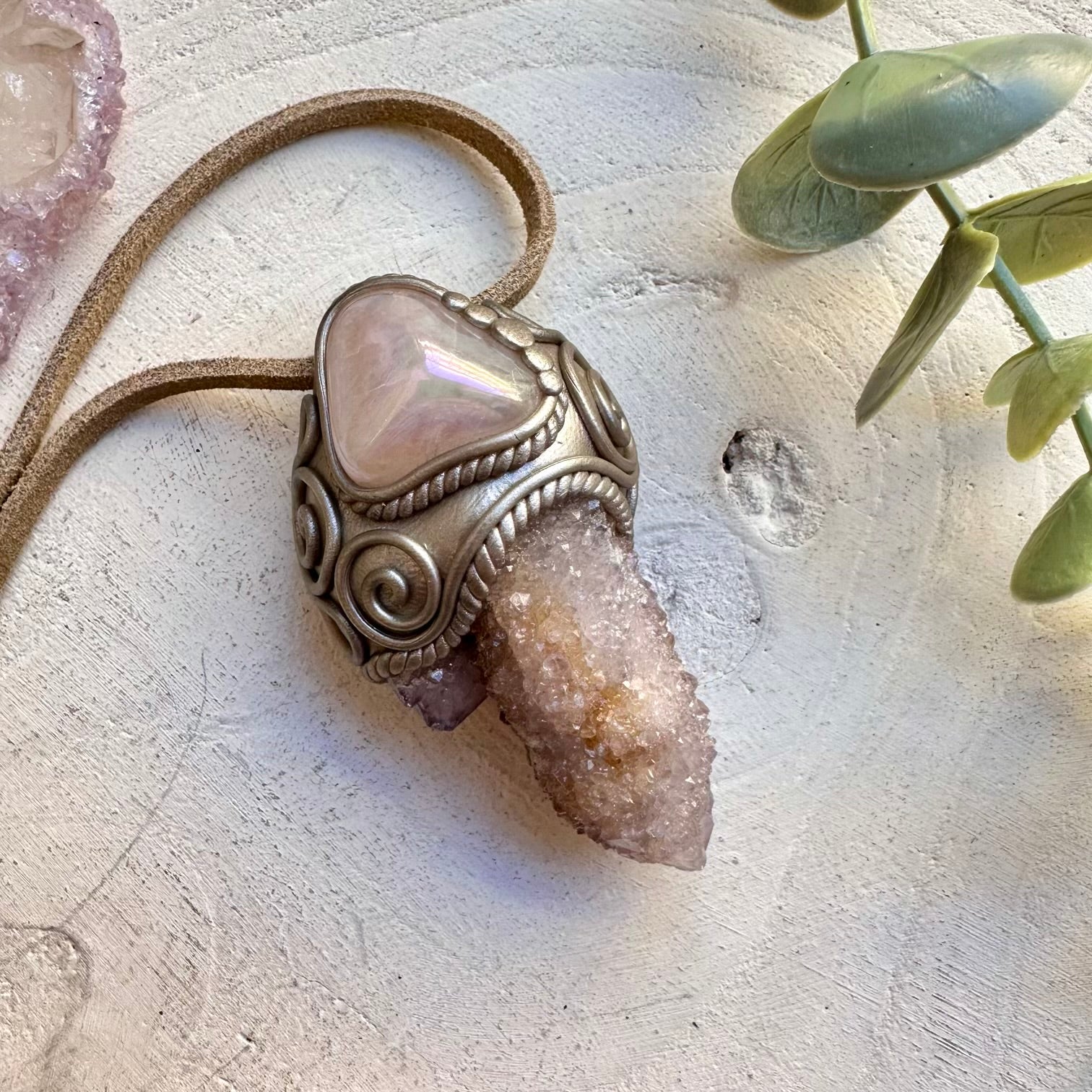 Angel aura rose quartz paired with spirit quartz in a necklace