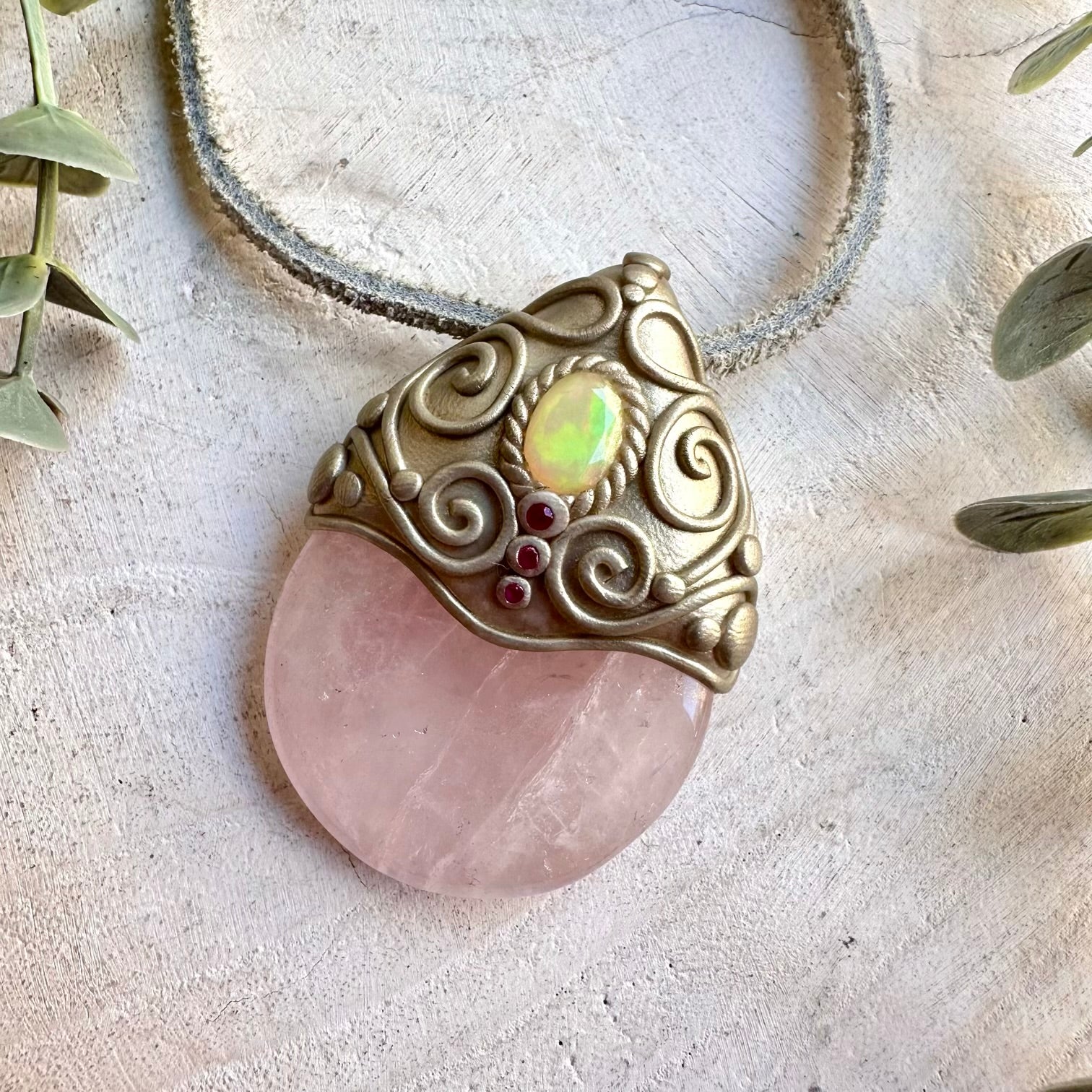 Artisan necklace showcasing soft pink Rose Quartz, luminous Ethiopian Opal and Ruby gemstone accents.