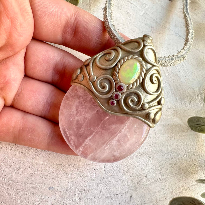 Handmade Rose Quartz, Ethiopian Opal and Ruby necklace, a one of a kind healing crystal jewelry piece combining soft pink Rose Quartz with mesmerizing Opal flashes and vibrant Ruby. An enchanting spiritual necklace for love, creativity, emotional healing, passion, confidence and personal transformation.