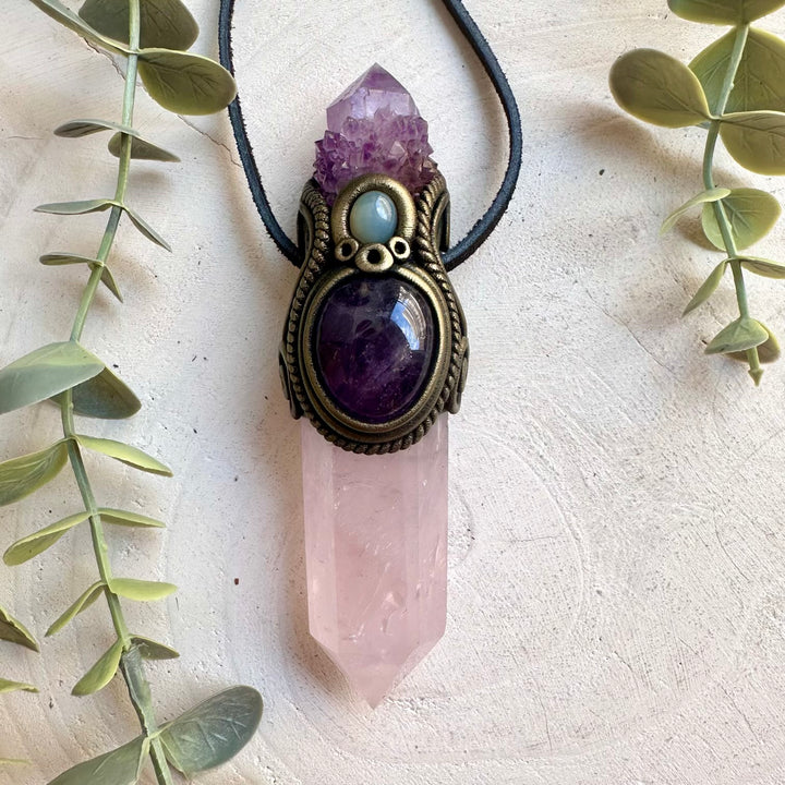 Handmade Rose Quartz crystal wand pendant necklace featuring Deep Purple Spirit Quartz, Amethyst and Chalcedony, a one of a kind healing crystal talisman designed for self-love, emotional healing, spiritual awakening and inner peace. Artisan gemstone jewelry crafted with genuine natural crystals for meditation, energy work and everyday wear.