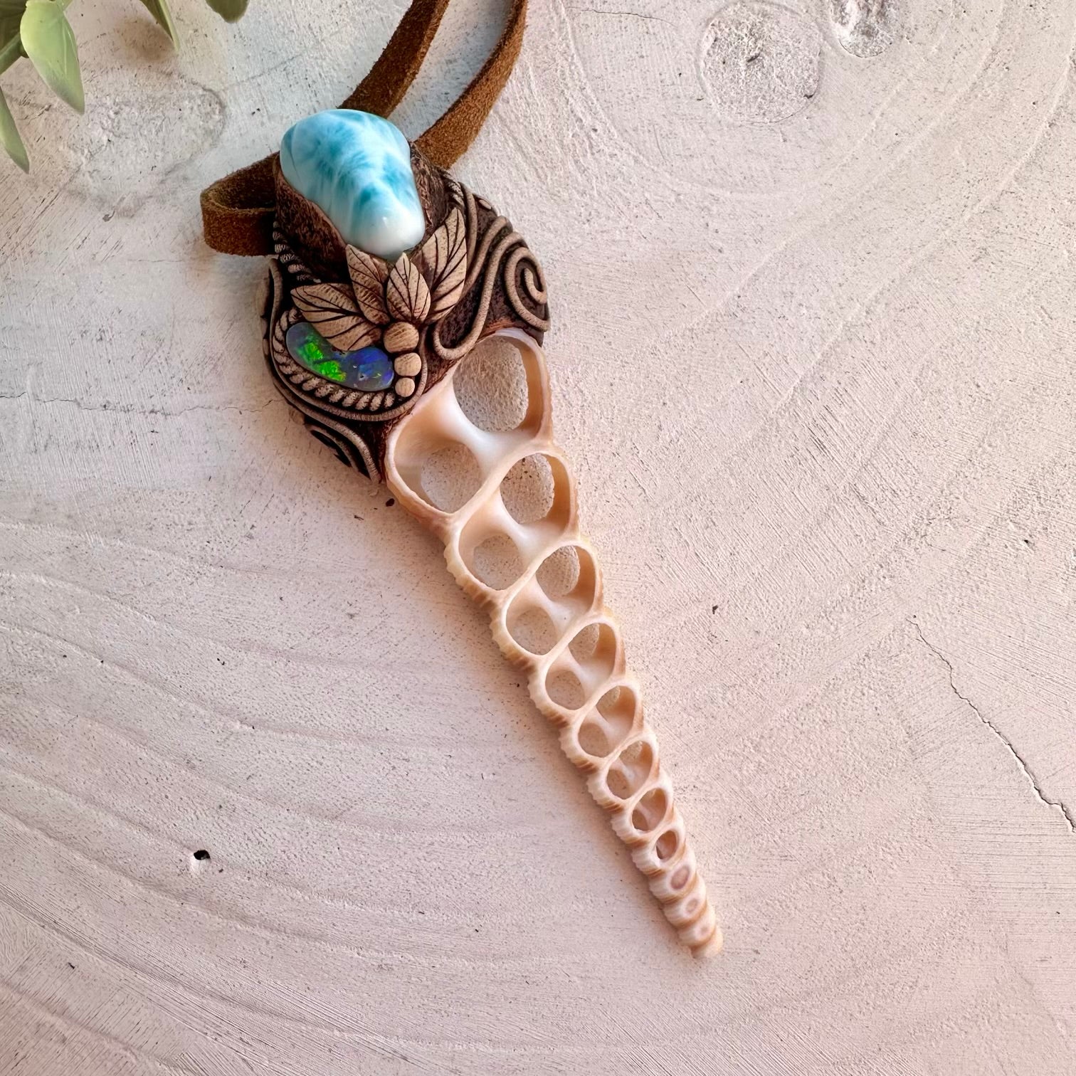 Handmade ocean-inspired necklace featuring a Terebra Turritella shell slice
