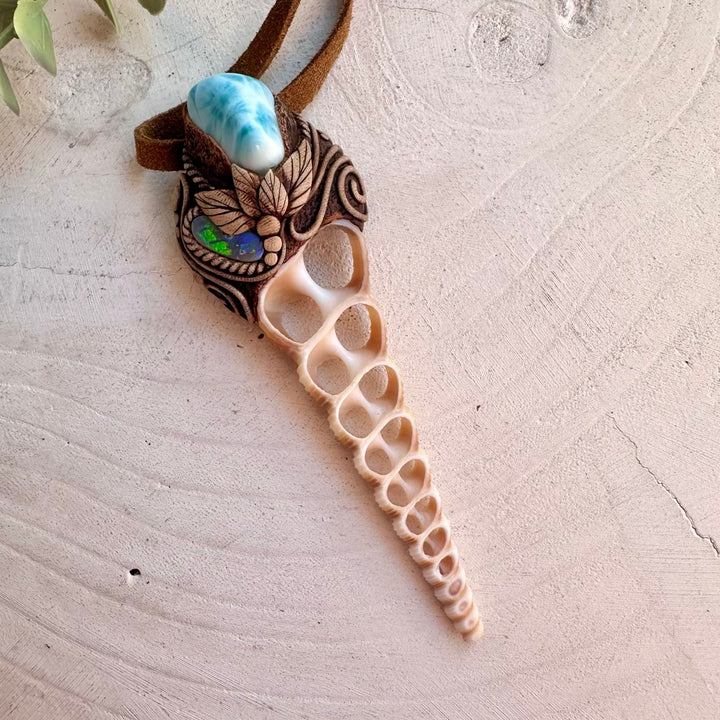 Handmade ocean-inspired necklace featuring a Terebra Turritella shell slice