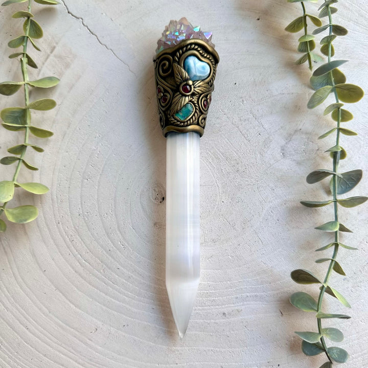 Handmade Selenite crystal wand featuring Angel Aura Spirit Quartz, Ethiopian Opal, Larimar Heart and Rhodolite Garnet. A one of a kind energy healing tool combining luminous Selenite with iridescent crystals and natural gemstones, created for meditation, intention setting, energy work and spiritual practice.
