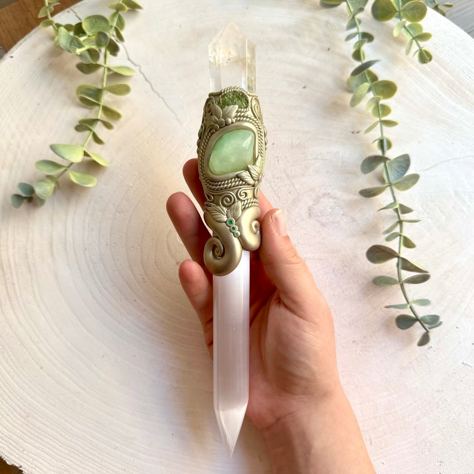 Handmade Selenite Crystal Wand adorned with Clear Quartz, Prehnite, Moldavite and Emerald. A unique handmade crystal wand for anyone drawn to mystical gemstones, spiritual practices and powerful symbolic energy.
