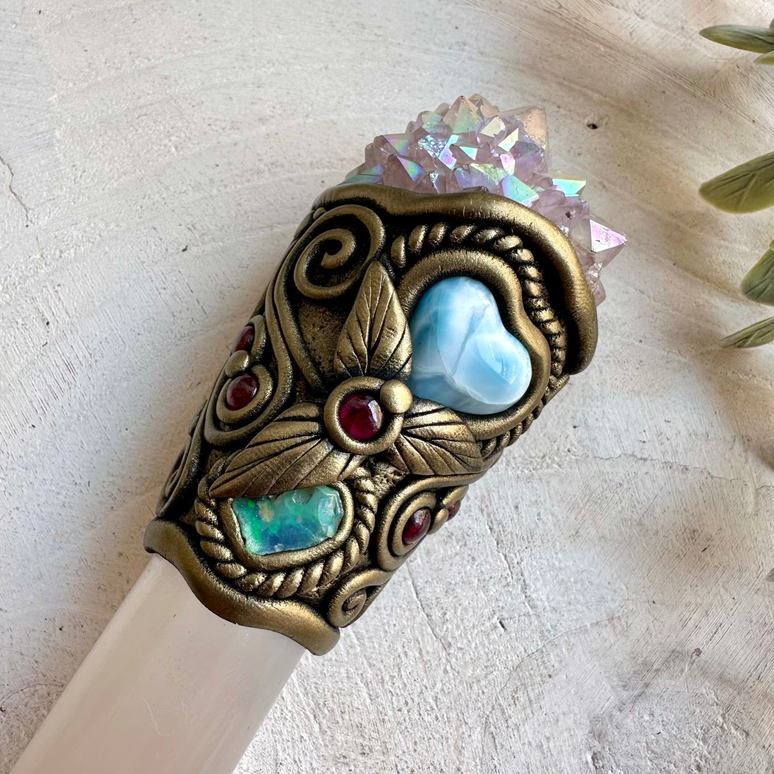 Unique crystal wand featuring an iridescent Angel Aura Spirit Quartz with a blue Larimar Heart.