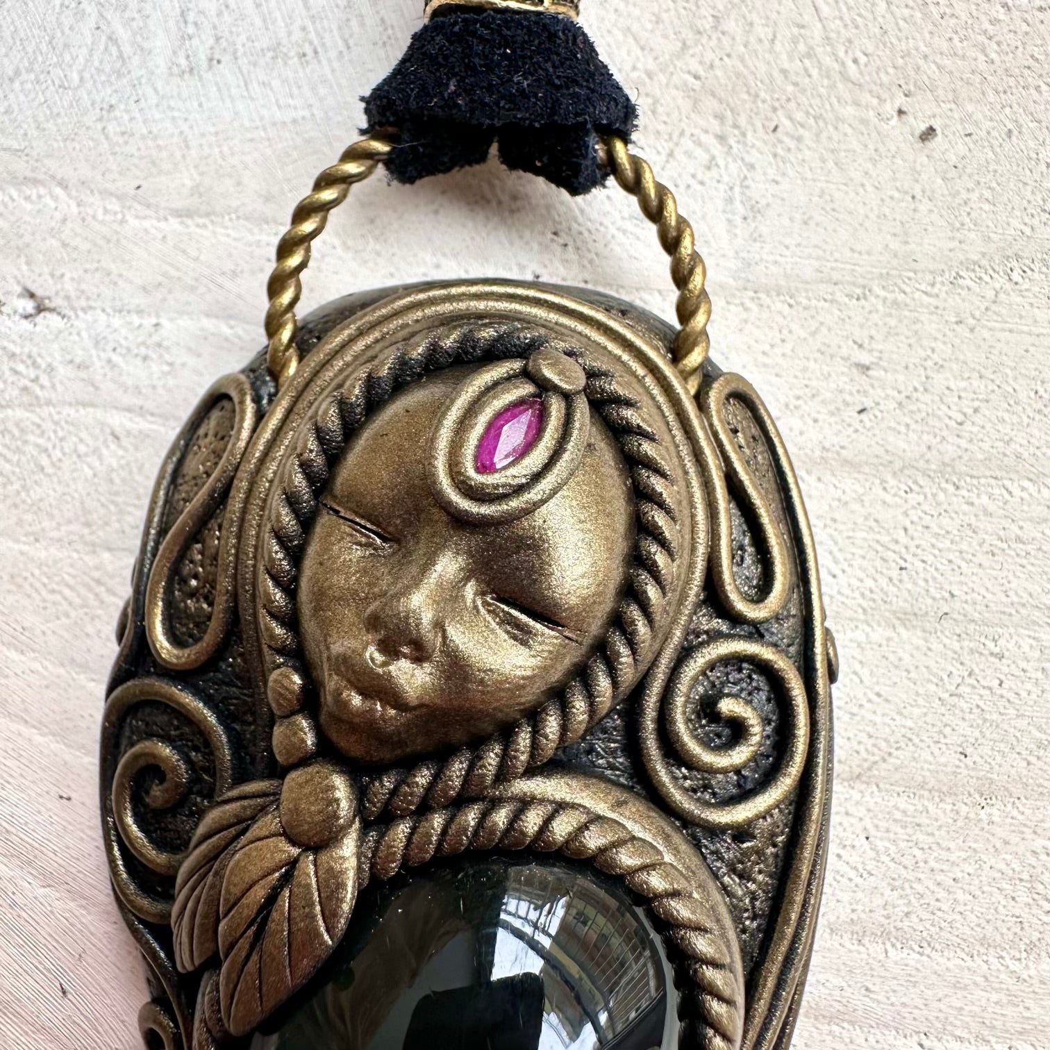 Spiritual jewelry combining rainbow obsidian rhodonite and ruby