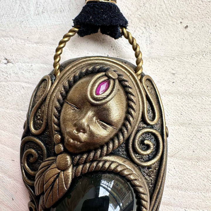Spiritual jewelry combining rainbow obsidian rhodonite and ruby