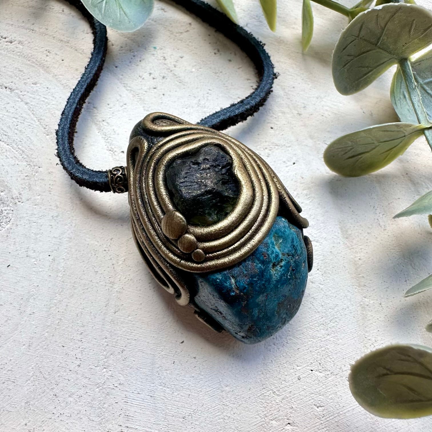 Natural shattuckite paired with raw moldavite in a necklace