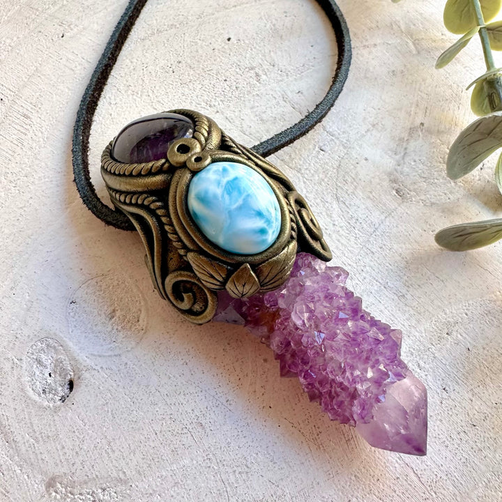 Artisan healing crystal pendant necklace showcasing a textured Spirit Quartz cluster with Larimar and Amethyst.