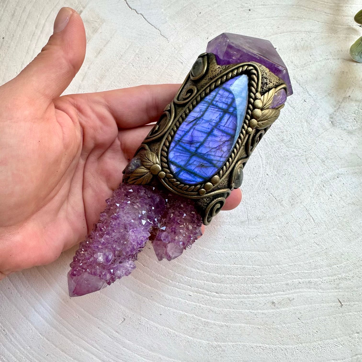 Handmade healing crystal wand featuring Spirit Quartz, Amethyst, Purple Labradorite, Charoite, Tanzanite and Clear Topaz. A one of a kind energy and ritual tool crafted with genuine natural crystals and gemstones, created for meditation, intention setting, spiritual practice and personal transformation.
