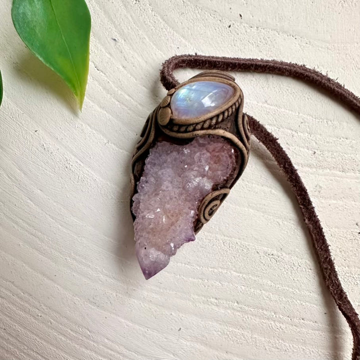 Spirit Quartz crystal pendant paired with Rainbow Moonstone