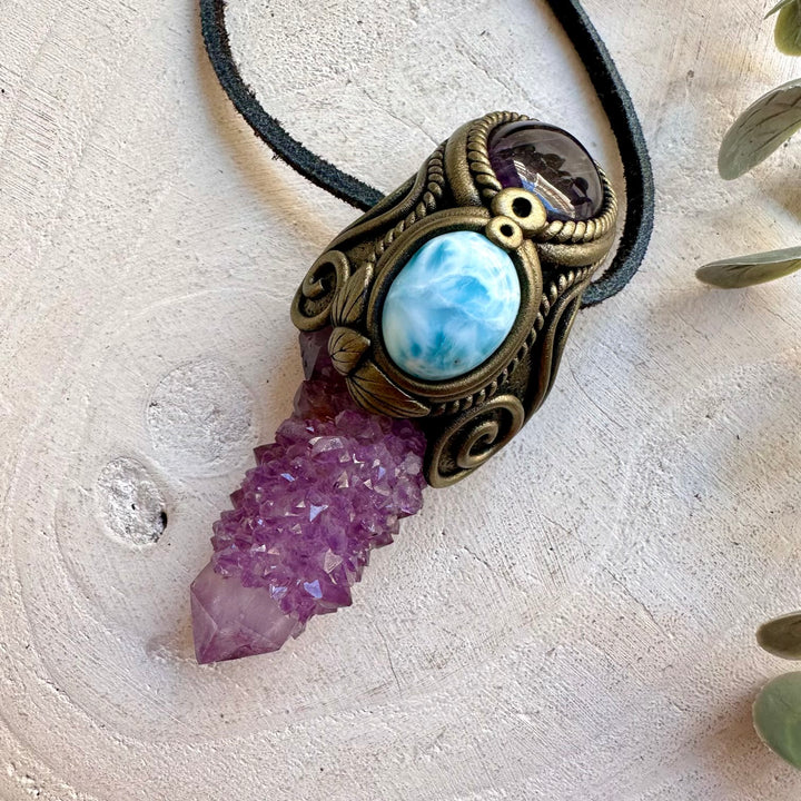 Handmade crystal jewelry with deep purple Spirit Quartz, ocean-blue Larimar and natural Amethyst.