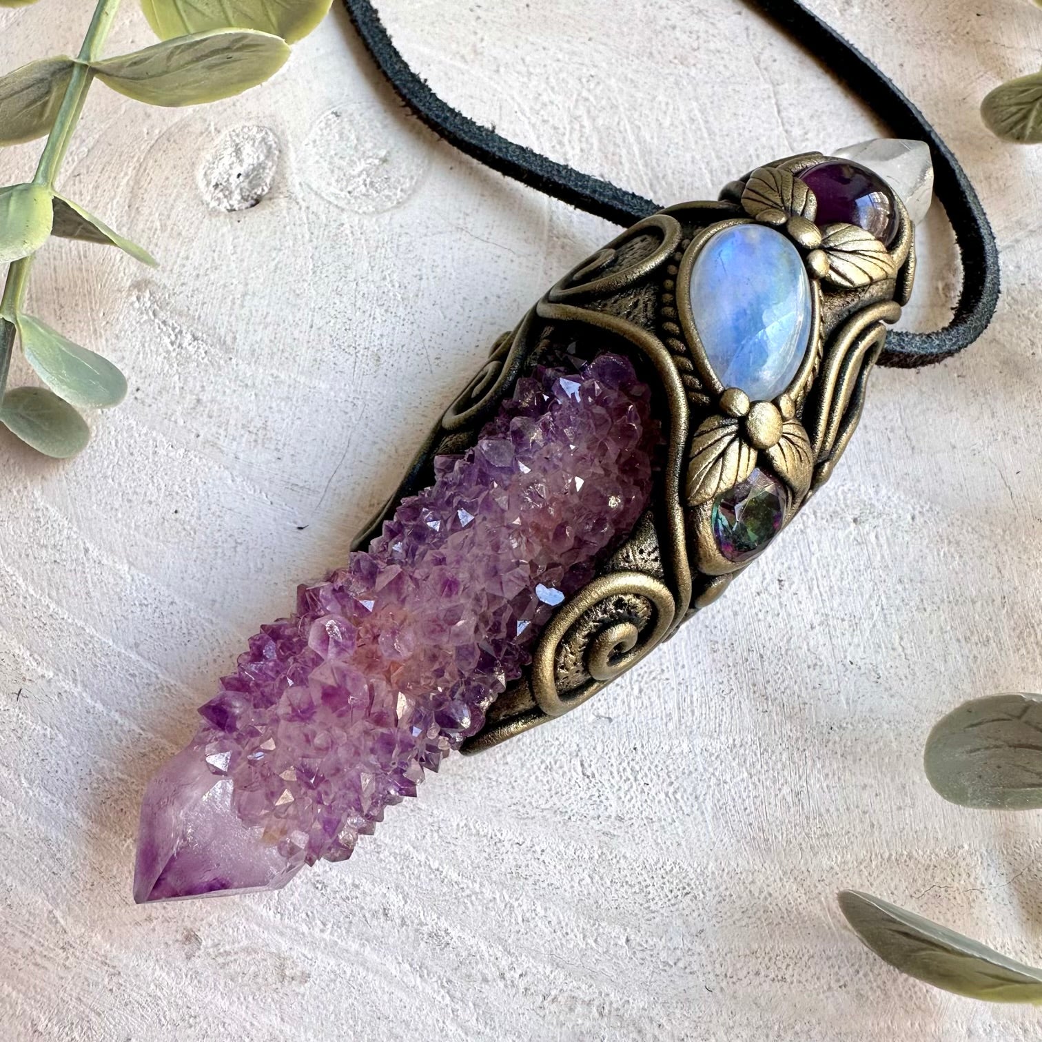 Handmade crystal jewelry featuring Long Spirit Quartz, Lemurian Seed Quartz and purple Amethyst.