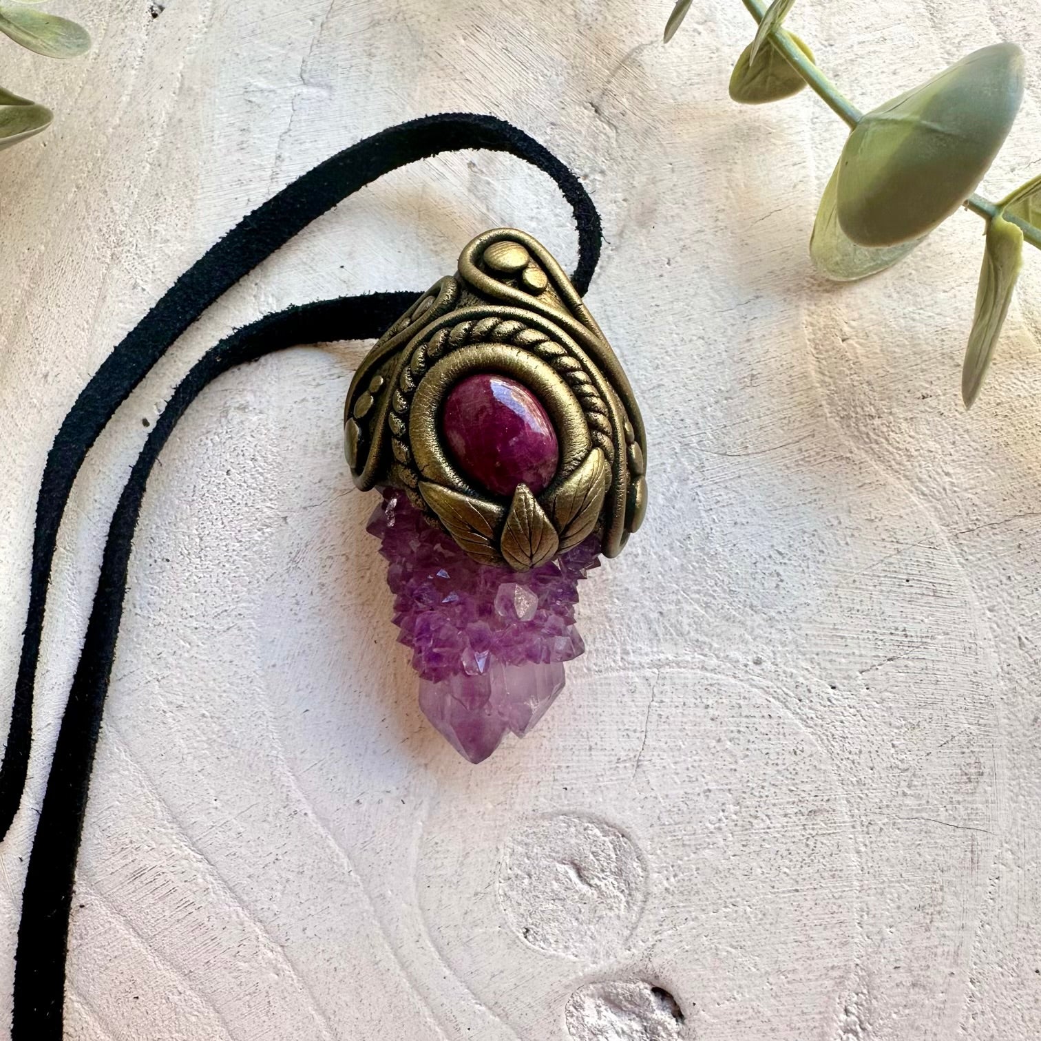 Artisan gemstone jewelry crafted with genuine natural crystals and clay.