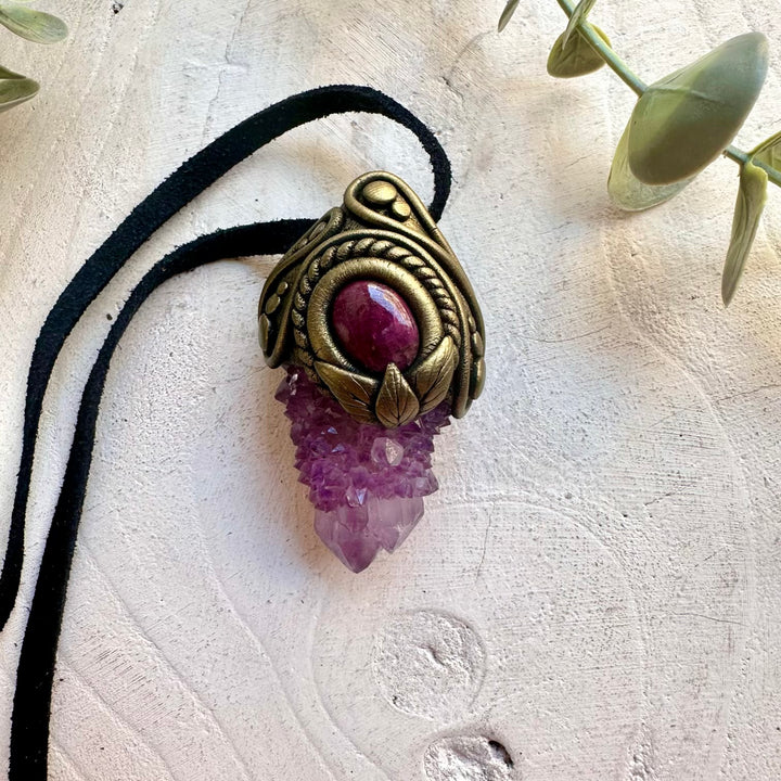 Artisan gemstone jewelry crafted with genuine natural crystals and clay.