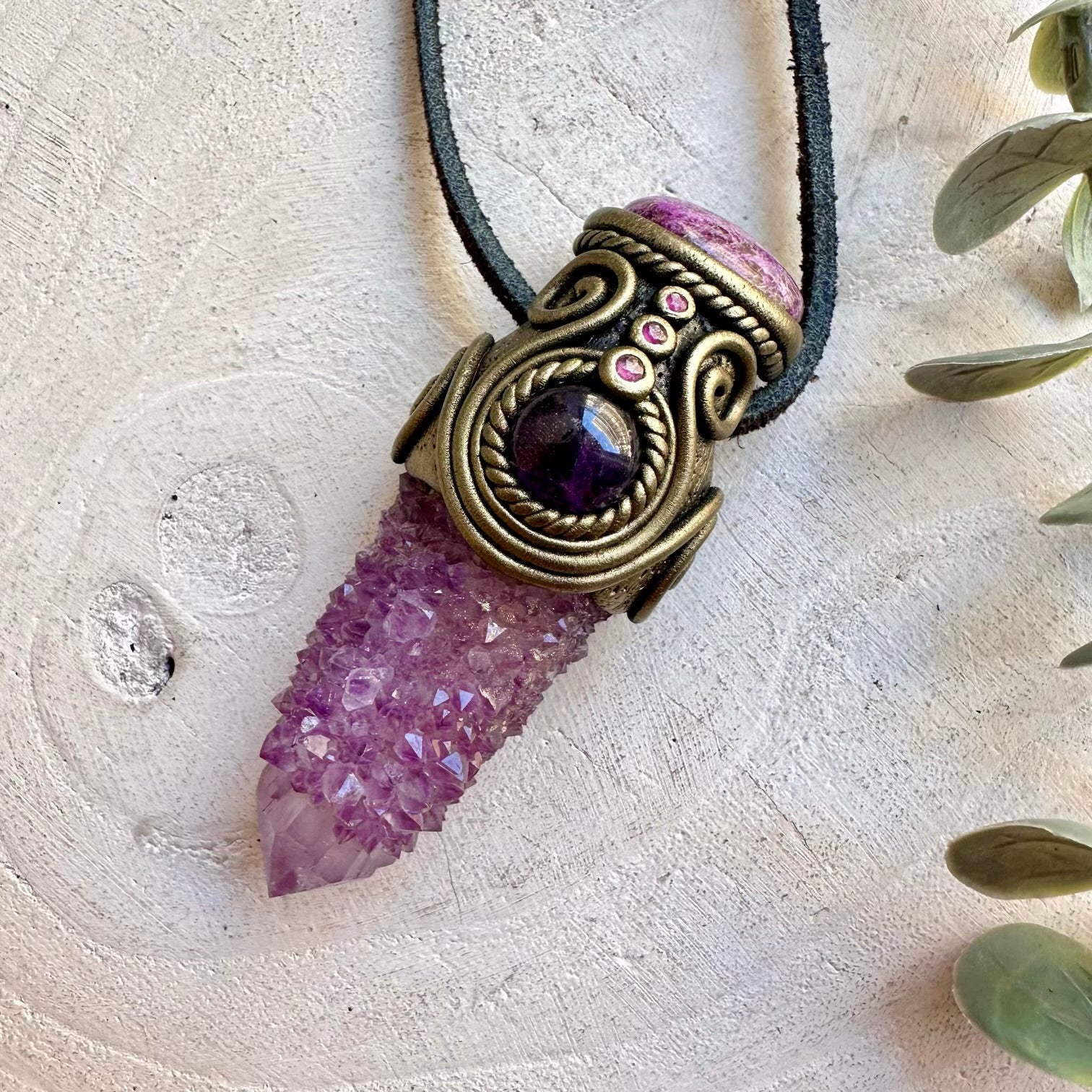 Unique crystal pendant featuring Spirit Quartz with soft pink Stichtite and rich purple Amethyst.