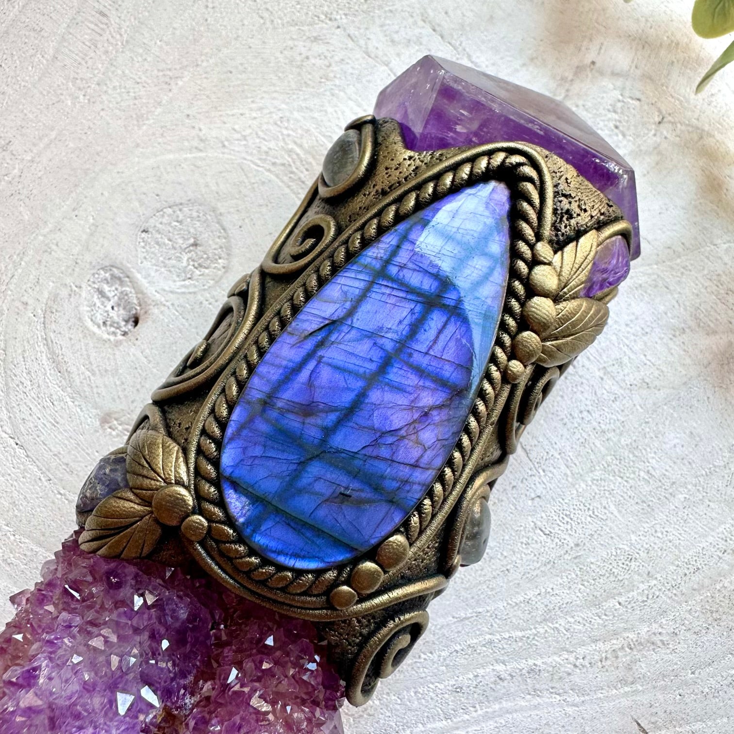 Natural crystal wand showcasing Charoite with shimmering Tanzanite and Clear Topaz.