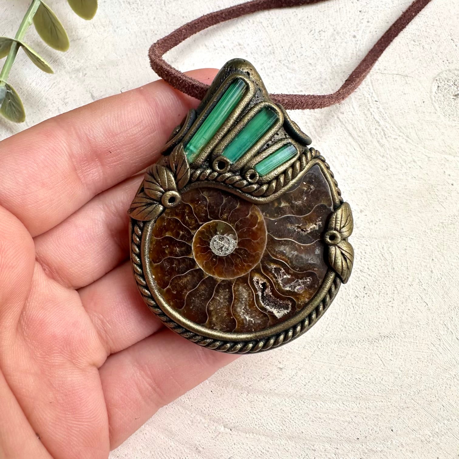 Metaphysical ammonite and green tourmaline necklace with healing gemstone and fossil details