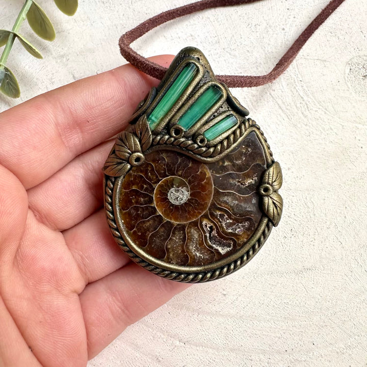 Metaphysical ammonite and green tourmaline necklace with healing gemstone and fossil details