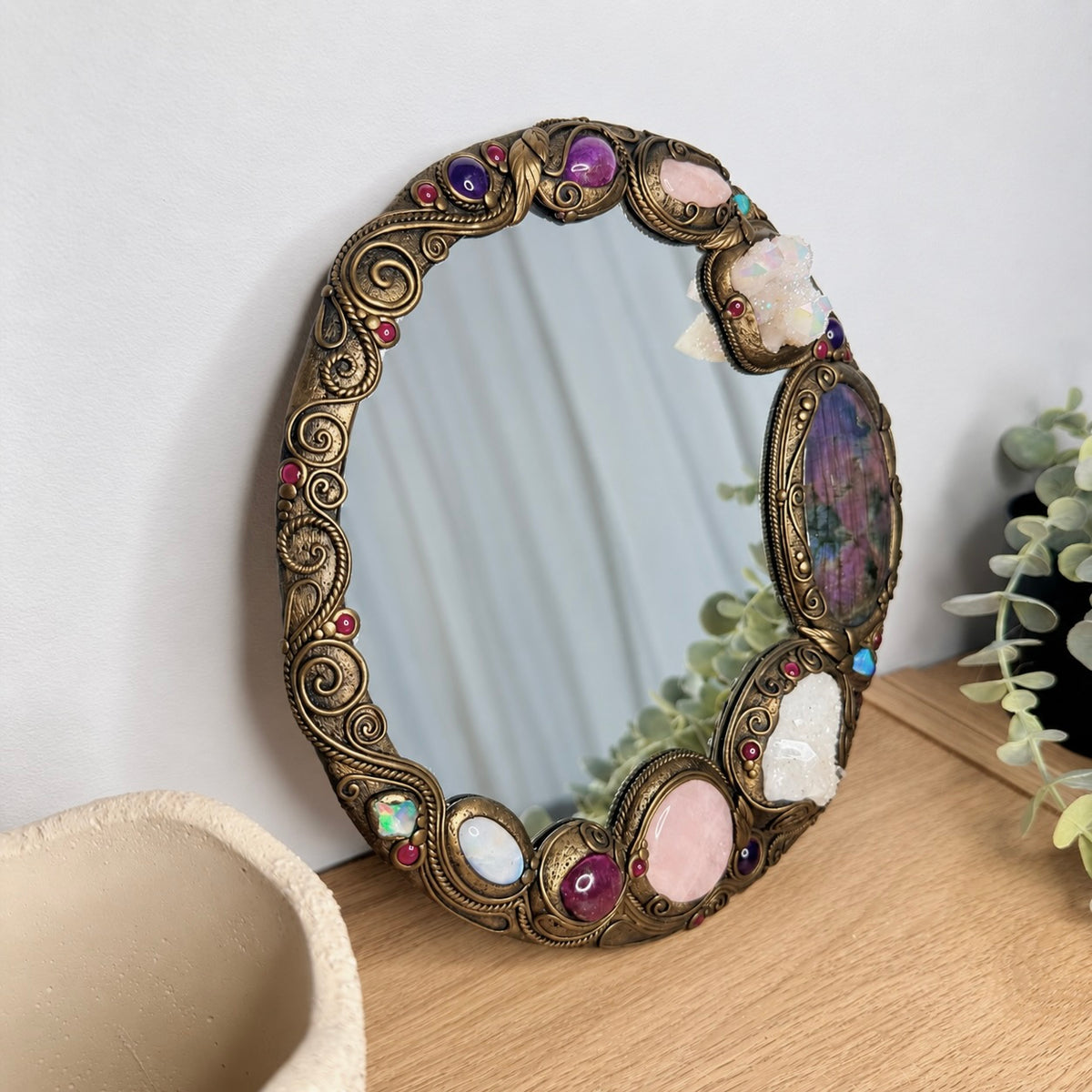 Spiritual altar mirror decorated with Purple Labradorite, Apophyllite and natural gemstones for a sacred space.