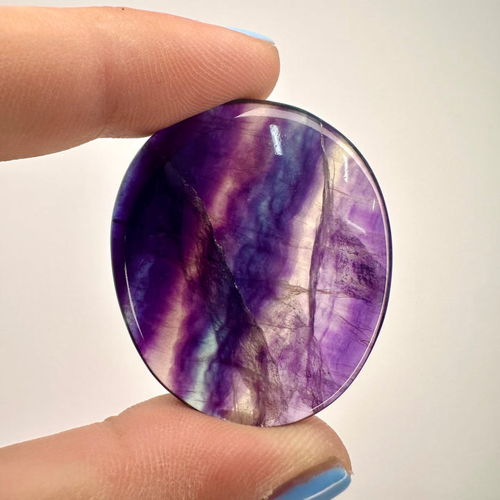 Close up of rainbow fluorite polished stone