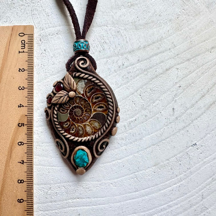 Handcrafted crystal jewelry with ancient Ammonite fossil and natural gemstone accents