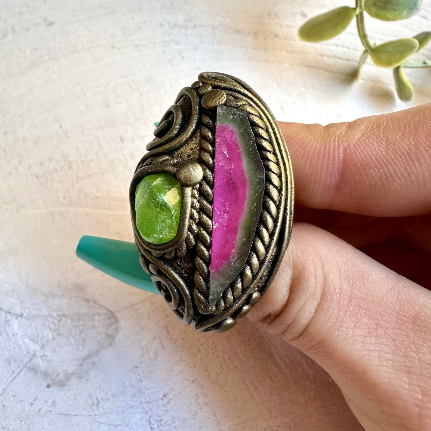 Watermelon tourmaline paired with peridot in a ring