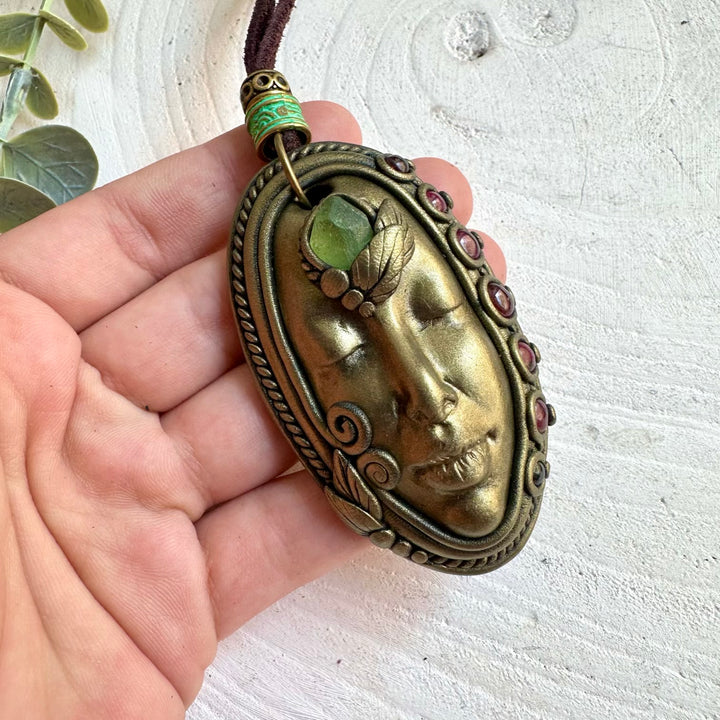 One of a kind Goddess pendant necklace with vibrant green Peridot and deep red Rhodolite Garnet.