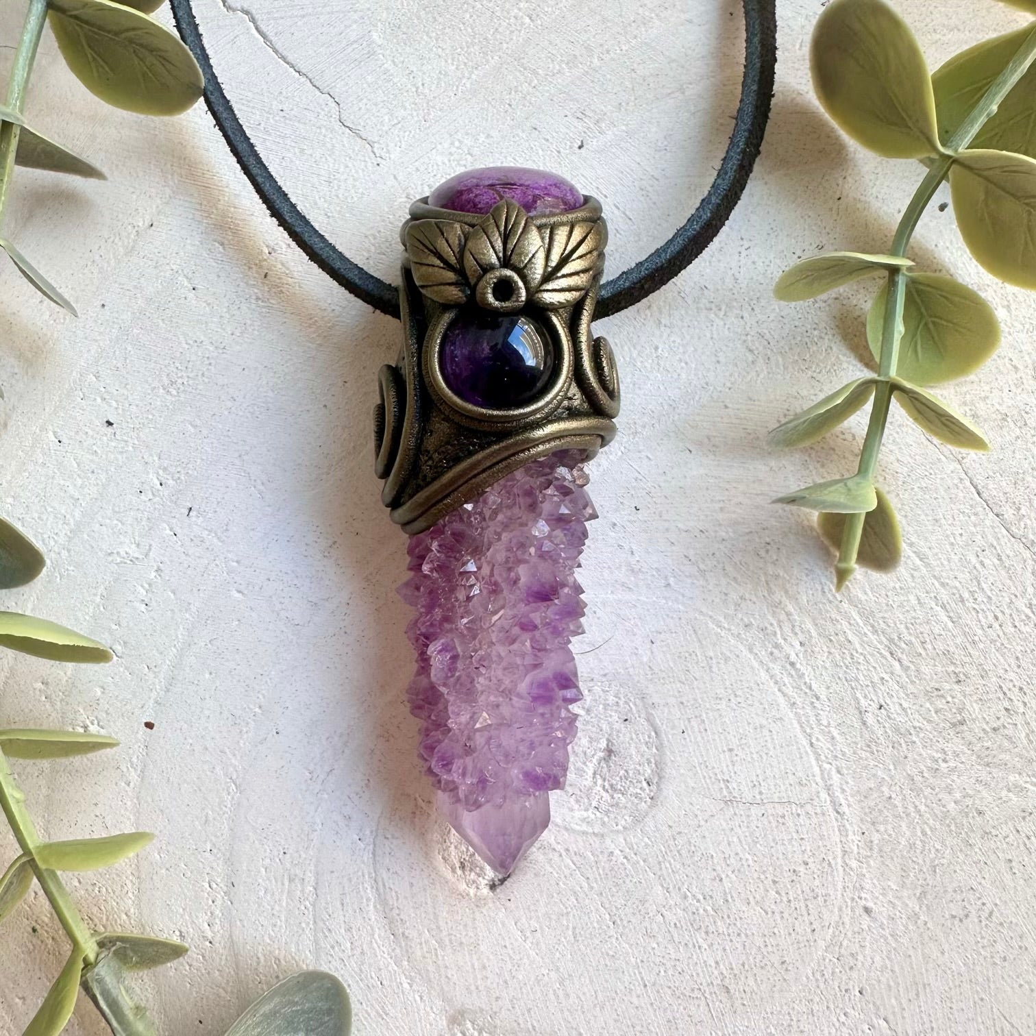 Natural crystal pendant showcasing Deep Purple Spirit Quartz with calming Stichtite and Amethyst.