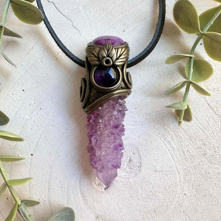 Natural crystal pendant showcasing Deep Purple Spirit Quartz with calming Stichtite and Amethyst.