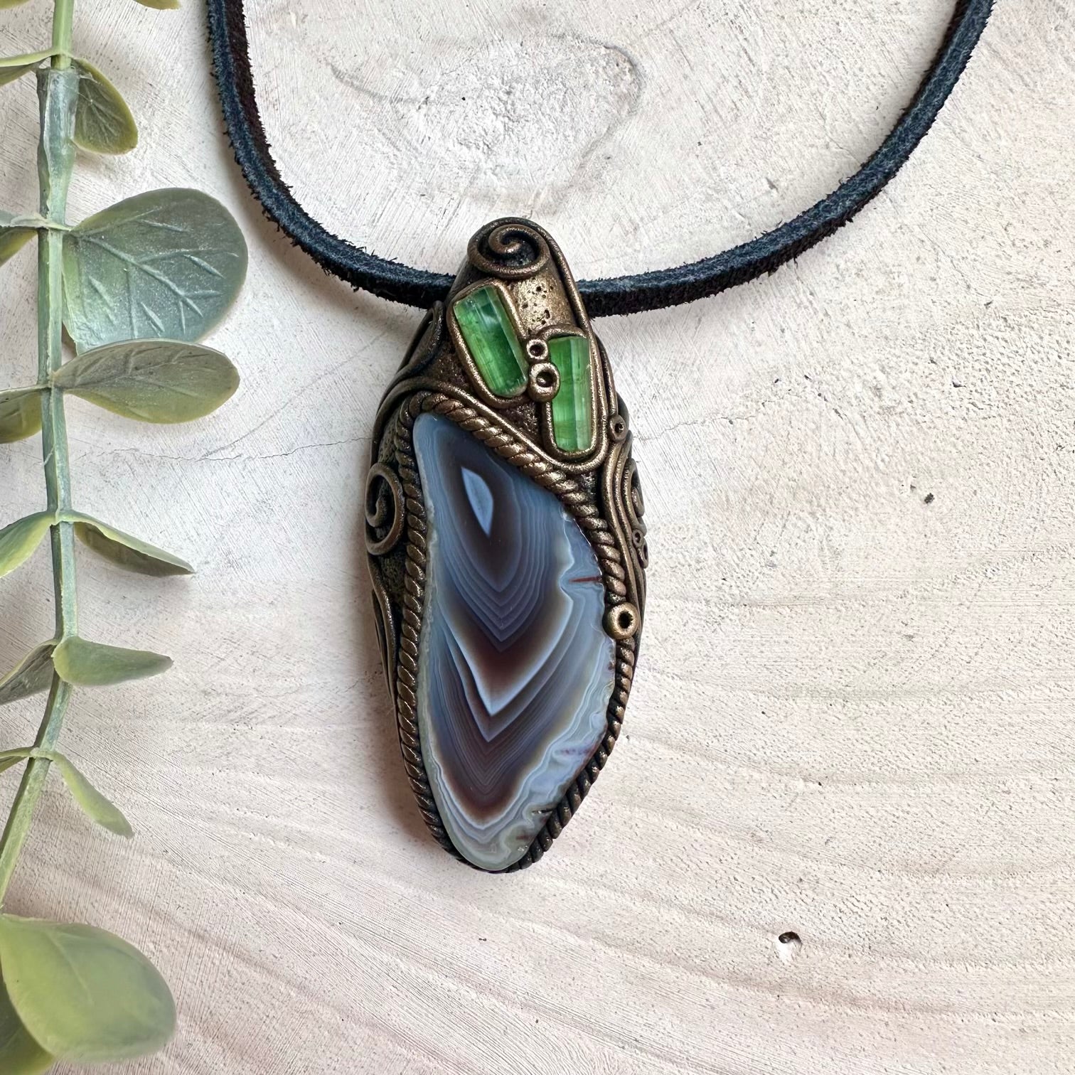 Crystal pendant necklace with Botswana Agate and Green Tourmaline designed for grounding and heart chakra healing.