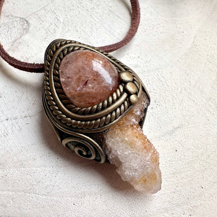 Metaphysical jewelry necklace with Spirit Quartz crystal and Hematite Quartz pendant for chakra healing.