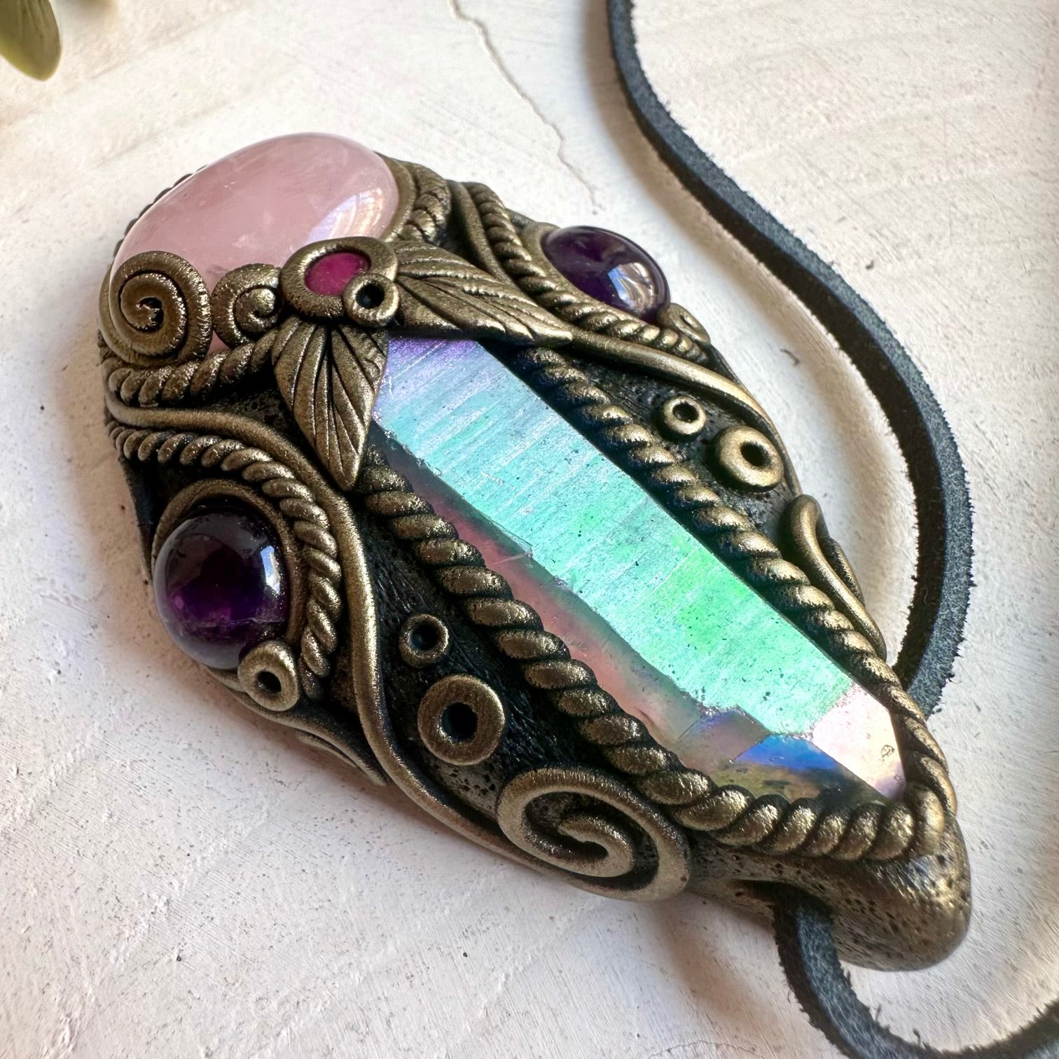 Natural gemstone jewelry showcasing a Rose Quartz pendant with an elegant Angel Aura Quartz Point.