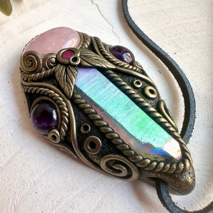 Natural gemstone jewelry showcasing a Rose Quartz pendant with an elegant Angel Aura Quartz Point.