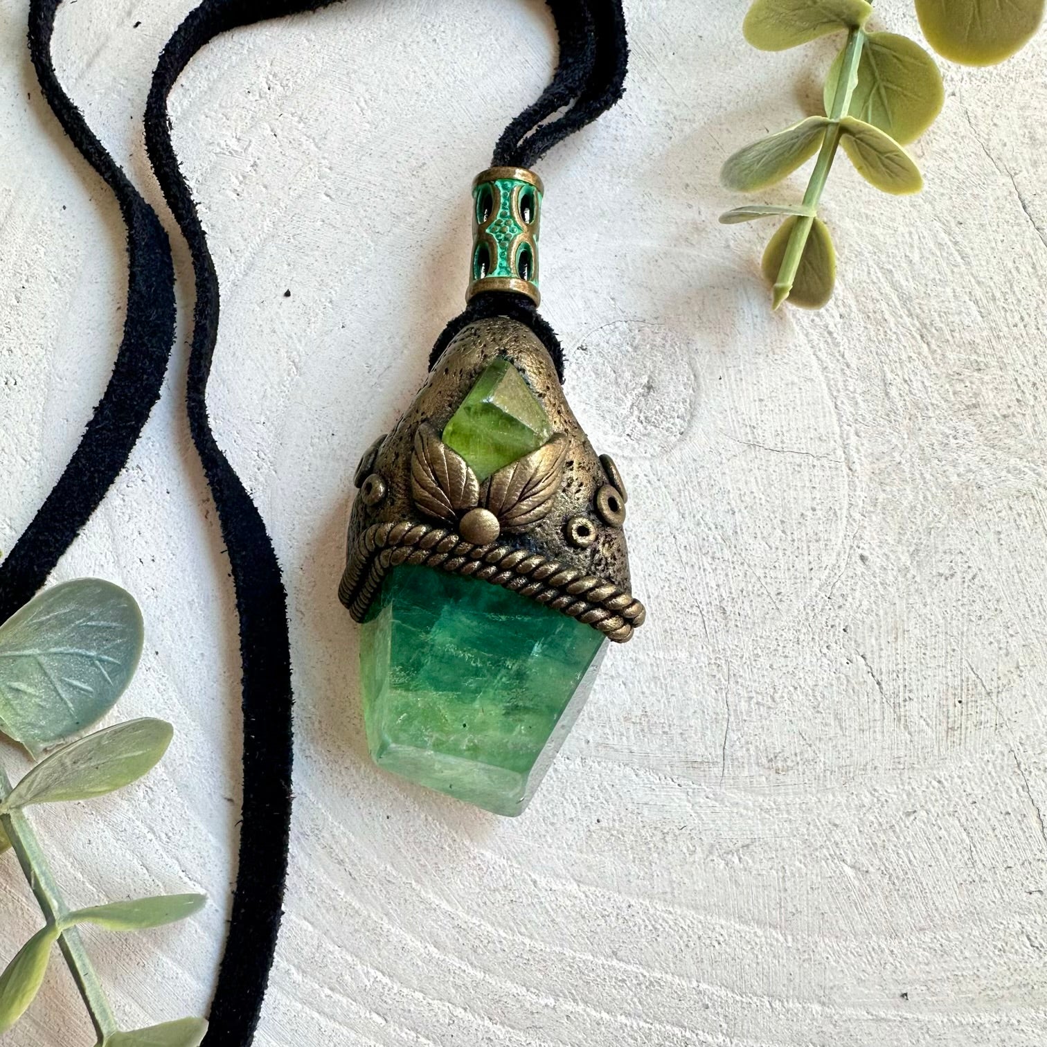 Green crystal pendant featuring natural Fluorite and Peridot with a fresh earthy look.
