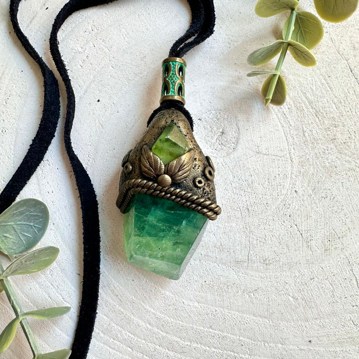 Green crystal pendant featuring natural Fluorite and Peridot with a fresh earthy look.