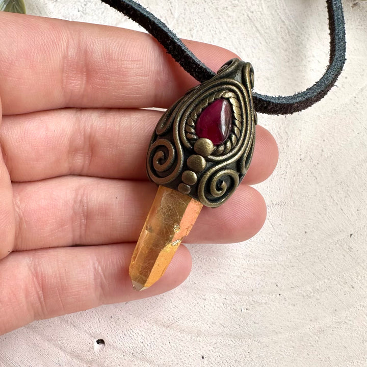 Handmade Sunset Aura Quartz and Rhodolite Garnet healing crystal necklace with spiritual gemstone pendant.