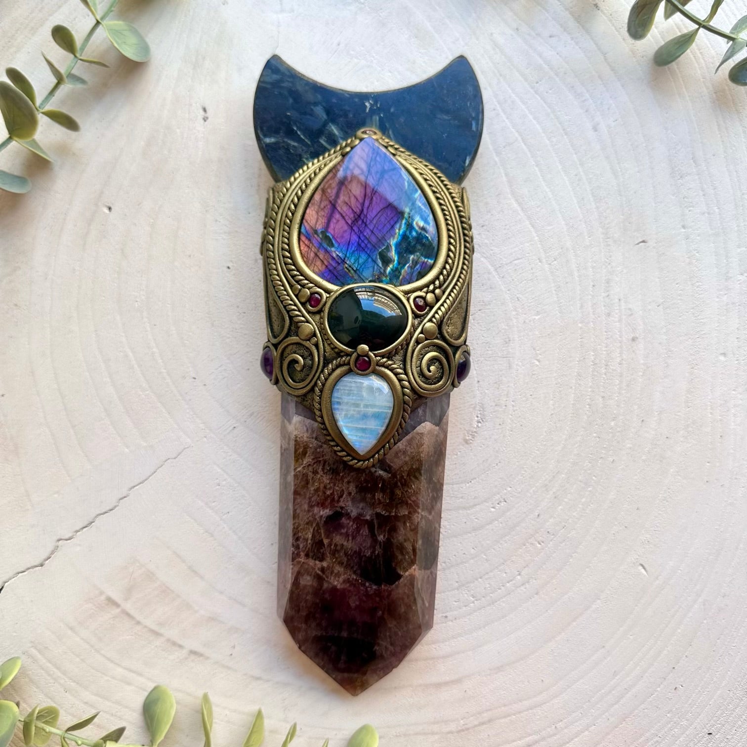 One of a kind healing crystal wand featuring Super Seven Quartz, Amethyst and Rhodolite Garnet.